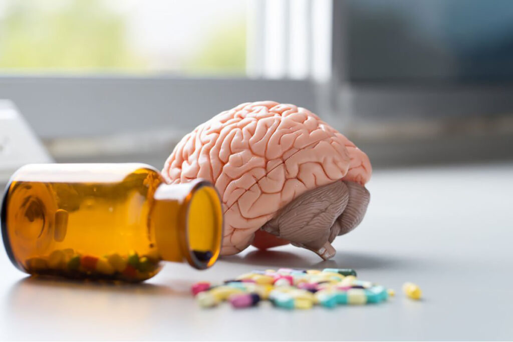 Drugs on the floor with the brain beside it