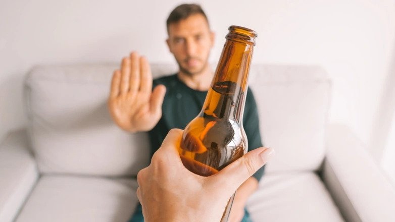 A person saying no to alcohol