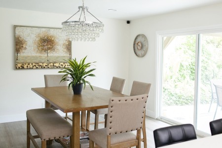 A well-furnished dining room with a wooden table and comfortable chairs for a cozy meal setting.