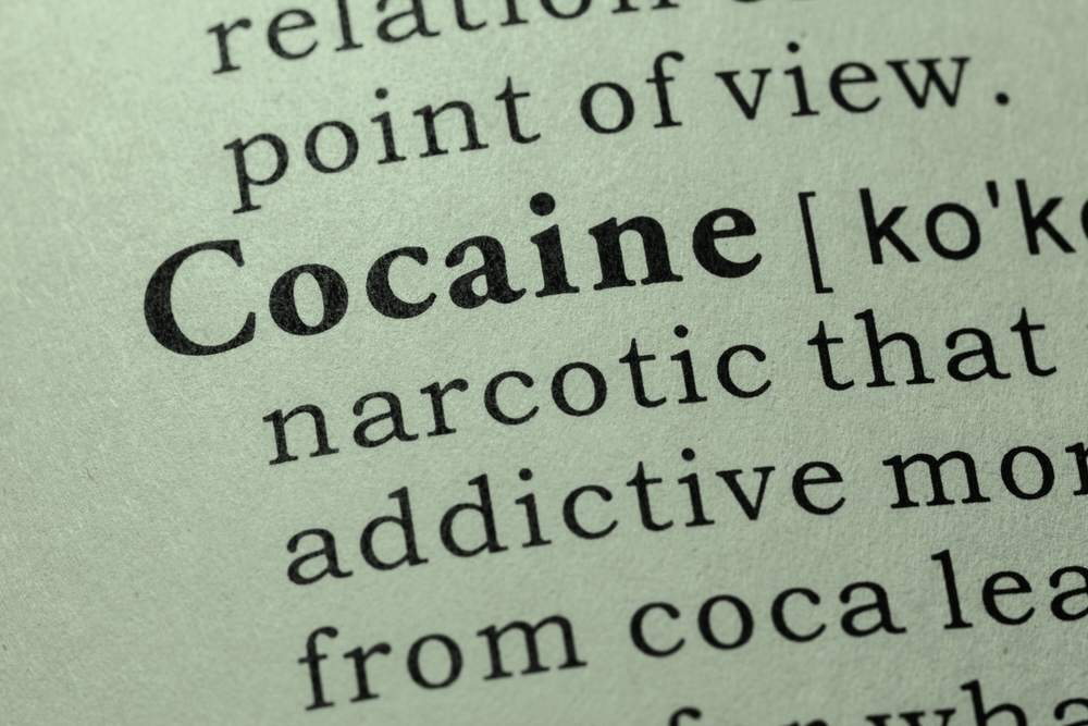Close-up on the word cocaine in a dictionary book