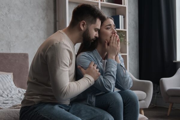 Male comforting his wife who struggles with bipolar disorder