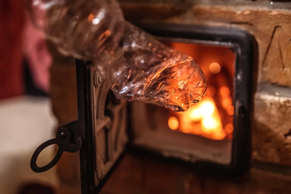 Close-up of plastic bottle burning , smells similar to crack cocaine