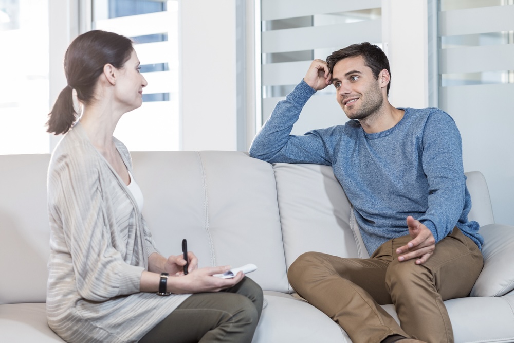 Man talking to a professional mental health specialist about his goals