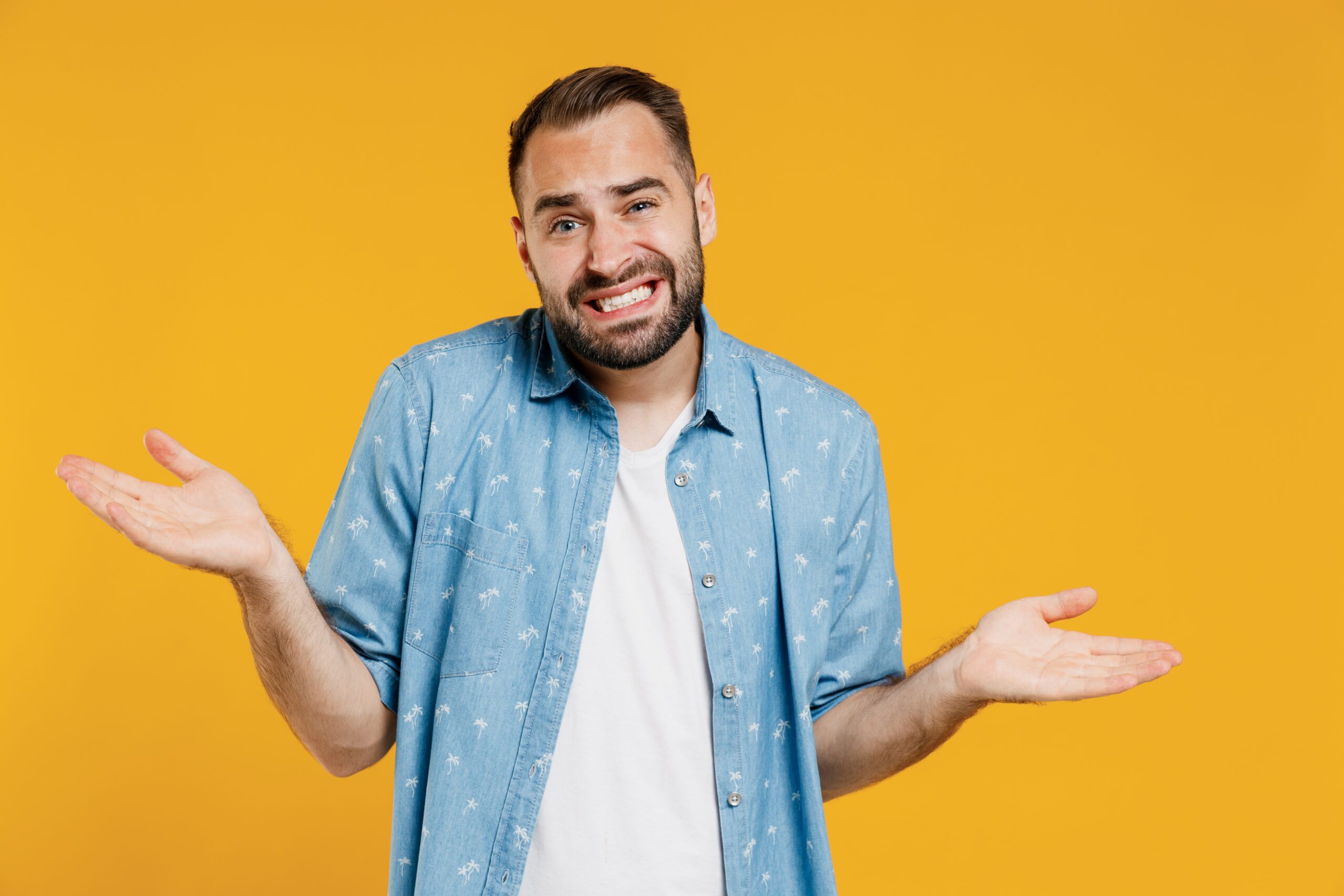 Man in blue shirt shrugging and questioning if Vyvanse abuse is dangerous