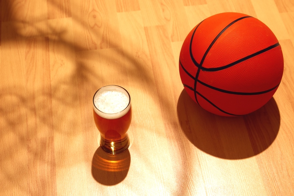 Bottle of beer with a basketball during March Madness game