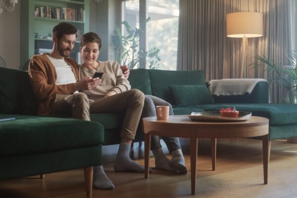 Couple sitting on a couch dealing with drug and alcohol addiction recovery reading quotes