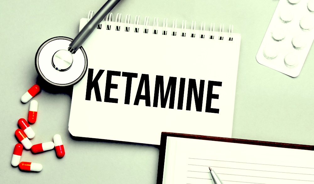 Doctor’s table with a notepad with the drug name ketamine written on it