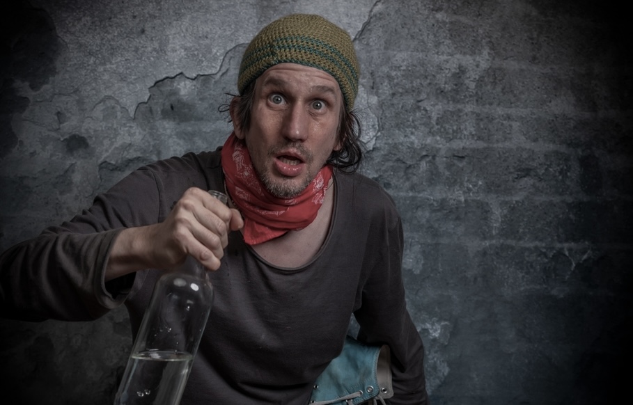 Man with alcohol use disorder drinking vodka