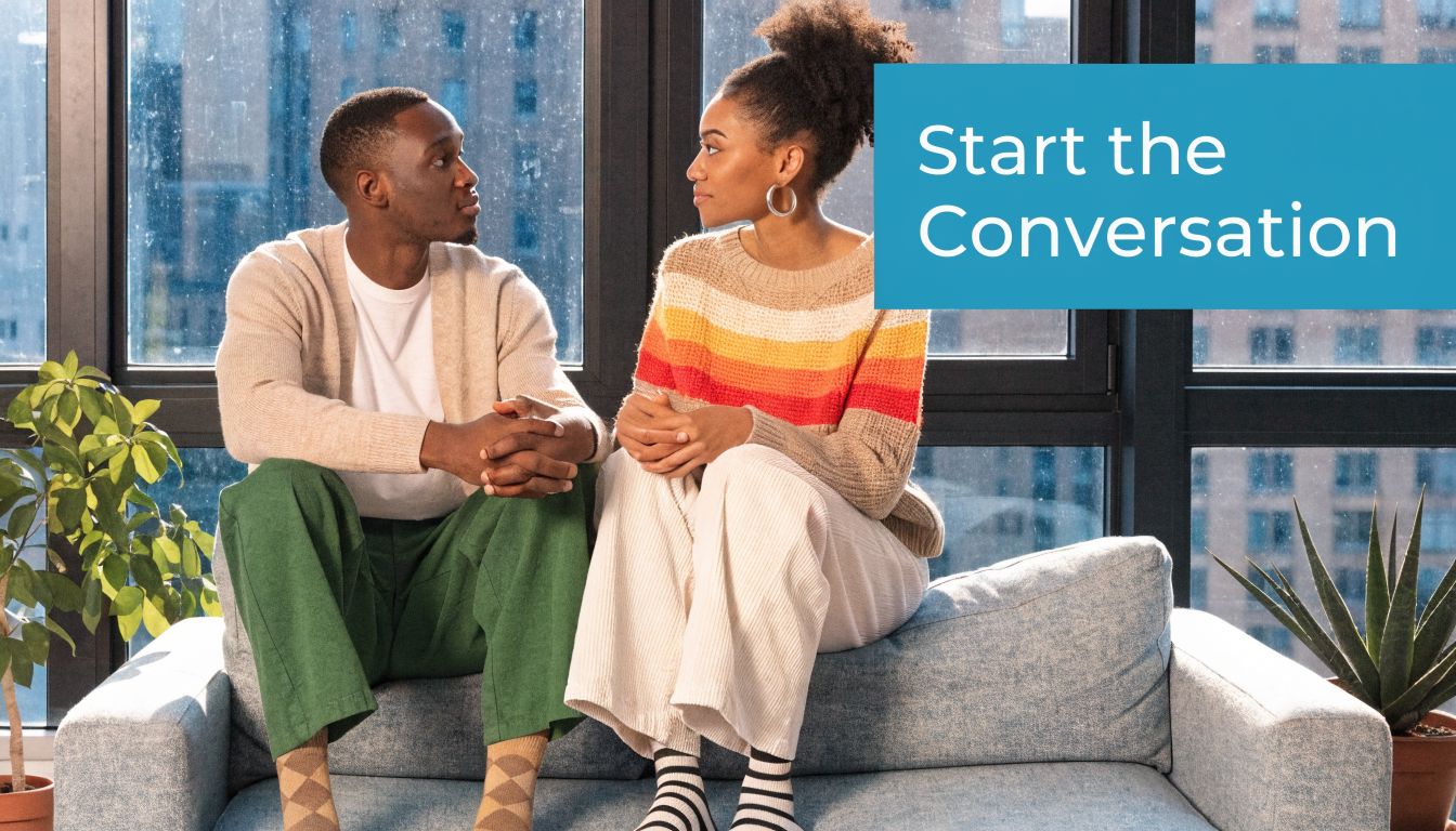 A couple sitting on a sofa looking at each other, suggesting the importance of having difficult conversations.